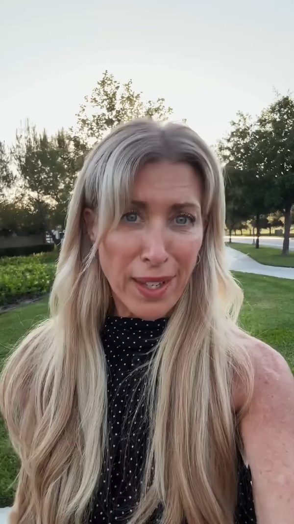 Erin Badour filming a brain-health video outdoors in a park